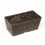 Sumatra, Batak, wooden lidded boxwith continuous floral design on both sides and reptile in low