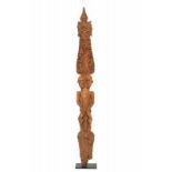 Borneo, Dayak, plank shaped cosmological figure,with a central standing spirit figure on top of a