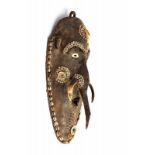 PNG, Middle Sepik, Iatmul, mwai mask,covered with clay, embellished with shells, human hair and