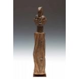 Nigeria, Wurkun-Waja, column figure,the arms framing the diamond shaped torso, pierced nose and