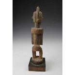 Mali, Dogon, standing figure,with central crest, standing on flexed legs. With dry encrusted patina.