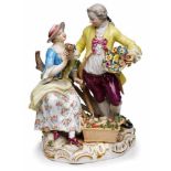 Gruppe "Gärtnerpaar", Meissen um 1860. Gold staffiert. Auf Fels sitzende Dame, zu ihren Füßen ein