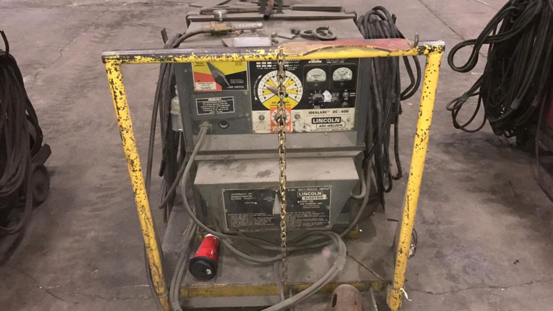 Lincoln idealarc DC-400 arc welder comes with mobile cart and hydraulic swivel arm, and has a