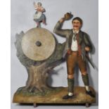 Schießhallenfigur "Oktoberfest", um 1900 Eisenblech, bemalt. Ein Treffer auf die Zielscheibe bewirkt