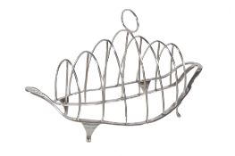 A George III silver shaped oval six division toast rack by Charles Chesterman, London 1796, with