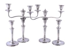 A set of four old Sheffield plate candlesticks with two candelabra branches by Matthew Boulton &