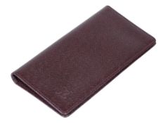 Louis Vuitton, a purple soft grain leather wallet, opening to six card slots and three
