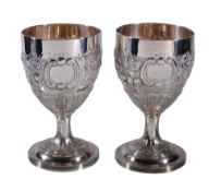 A pair of George III silver goblets by William Abdy II, London 1805, each later chased with a