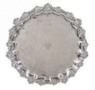 A Victorian silver shaped circular salver by William Savory, London 1863, with a moulded shell and