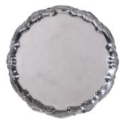 A George II silver shaped circular salver by William Peaston, London 1747, with a raised moulded
