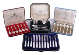 Ω A collection of mainly silver flatware, to include: a cased set of six knives and forks by
