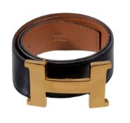 Hermes, Constance, a reversible belt, in black and tan leather, 1984, blind stamped P in a circle,