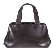 Prada, a small brown leather handbag, with twin loop leather handles, clasp fastener opening to a