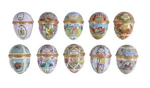 Ten Halcyon Days enamel Easter eggs, 1990 to 1999, each in its box; with some stands