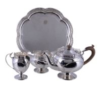 A silver three piece tea service by Reid & Sons Ltd., London 1913 and 1915, the tea pot with a