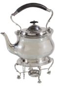 A silver oval baluster tea kettle on stand by William Hutton & Sons, Sheffield 1912, with a