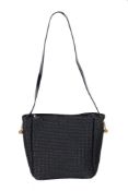 Bottega Veneta, a black woven shoulder bag, with black patent leather shoulder strap, press button