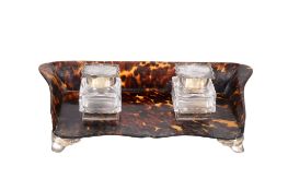 Ω A silver mounted tortoiseshell shaped rectangular inkstand by William Comyns & Sons Ltd