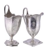 Two George III silver helmet shaped cream jugs, the first octagonal and bright-cut by Henry