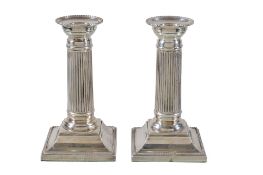 A pair of silver columnar candlesticks by C. J. Vander Ltd, Sheffield 1998, with beaded fixed