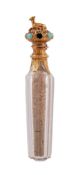 A French gold mounted clear glass scent bottle, circa 1870, with a recumbent hind finial to the