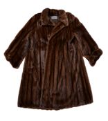 A lady's Scanglow brown female mink coat (Italy), retailed by Philip Hockley, with full length