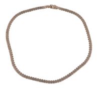 A 1960s collar necklace, the textured brick links to a concealed clasp stamped 9ct, 21.3g, 42cm
