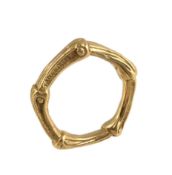 An 18 carat gold bamboo ring by Tiffany & Co., of bamboo design, stamped T & Co 750, finger size K