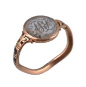 A George III mourning ring , the central oval panel with scrolled foliate initials R W below a