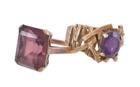 A 9 carat gold amethyst ring, the oval cut amethyst claw set on a textured openwork setting,