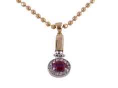 A sapphire, ruby and diamond pendant, the oval pendant set with an oval cut sapphire and an oval