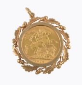 A Sovereign pendant, the 1914 full Sovereign in an acorn and oak leaf surround, 3.9cm long, 12.4g