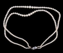A two row cultured pearl necklace, the two rows of graduating cultured pearls to the clasp set with