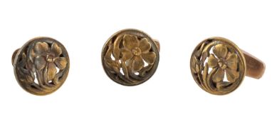 Three late 19th century French gold foliate studs, circa 1890, the circular panels with pierced