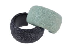A black stingray cuff bangle, impressed Maximo, 5.5cm inner width; and a similar one in green