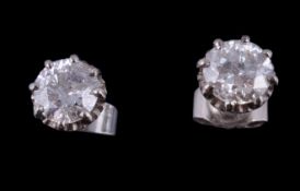 A pair of diamond single stone ear studs, the brilliant cut diamonds, estimated to weigh 1.40