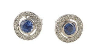 A pair of sapphire and diamond earrings, centrally set with circular cut sapphires collet set