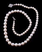 A cultured pearl necklace, composed of graduating cultured pearls, to the clasp set with brilliant