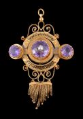 An amethyst brooch/pendant, the central circular cut amethyst set with a half pearl, within a