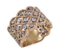 A diamond ring, of foliate lattice design, set with brilliant cut diamonds, approximately 0.65