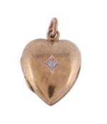 A late Victorian diamond accented heart locket, circa 1900, the old cut diamond in a squared