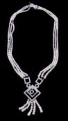 A freshwater cultured pearl and diamond necklace, the central openwork square panels set with eight