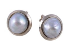 A pair of cultured pearl earrings, the cultured pearls within polished surrounds, with post