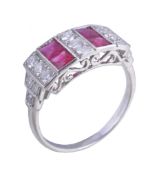 A ruby and diamond panel ring , the two rows of French cut rubies interspaced with three rows of