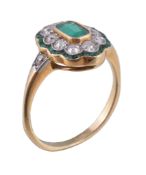 An early 20th century emerald and diamond ring, the central rectangular cut emerald, collet set