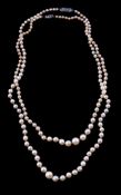 A cultured pearl necklace, the graduating cultured pearls to the clasp set with three rose cut
