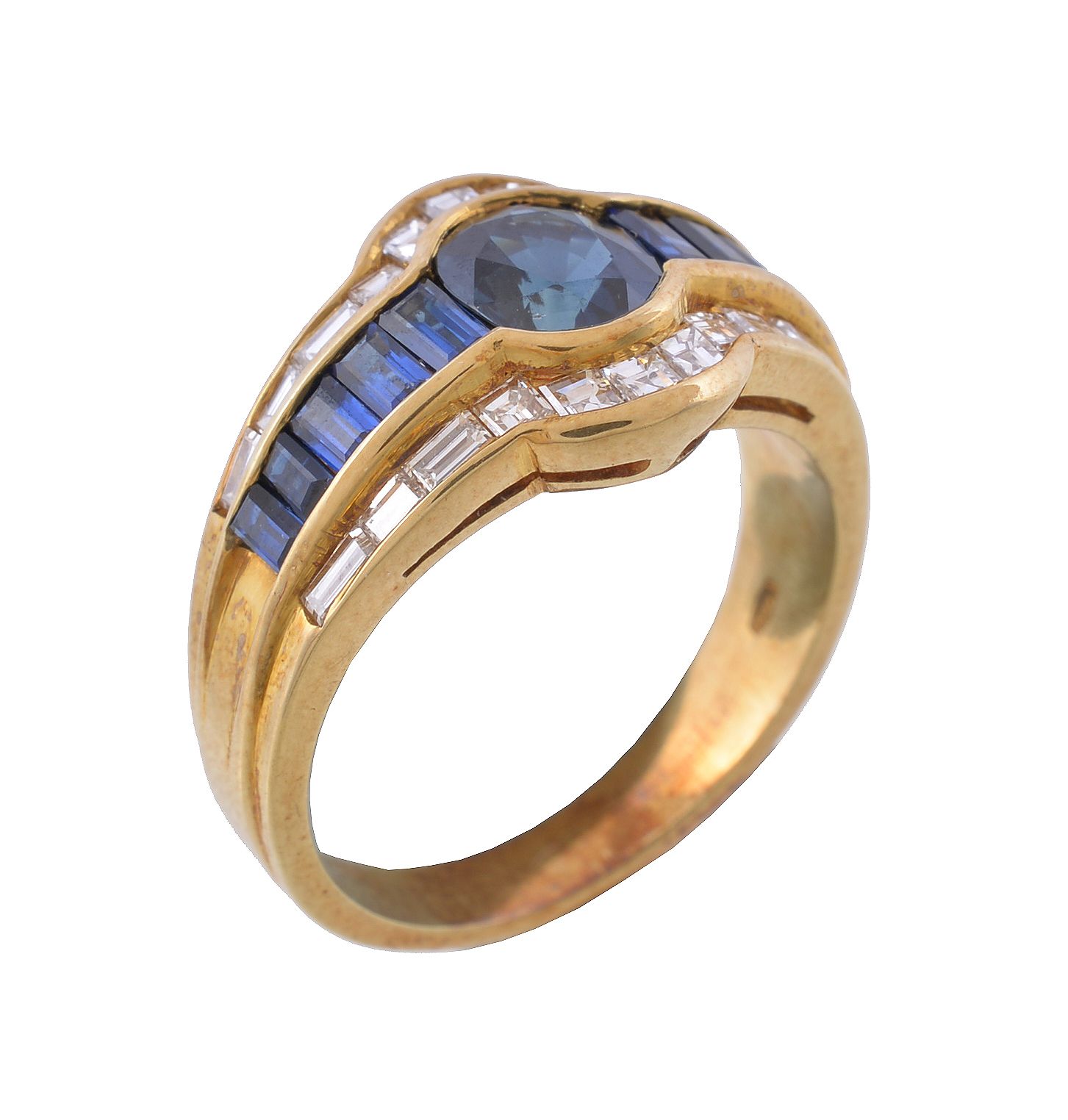 A sapphire and diamond ring, the central oval cut sapphire between rectangular cut sapphires, to a