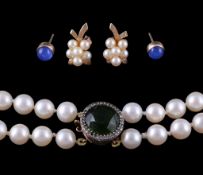 A two row cultured pearl necklace, the graduated cultured pearls to a green stone and white paste