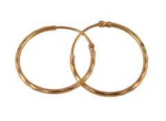 A pair of gold coloured ear hoops, of facetted design, with post fittings, 3cm diameter, stamped