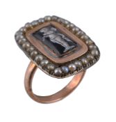 A 19th century enamel and seed pearl ring, the central rectangular panel enamelled with a standing